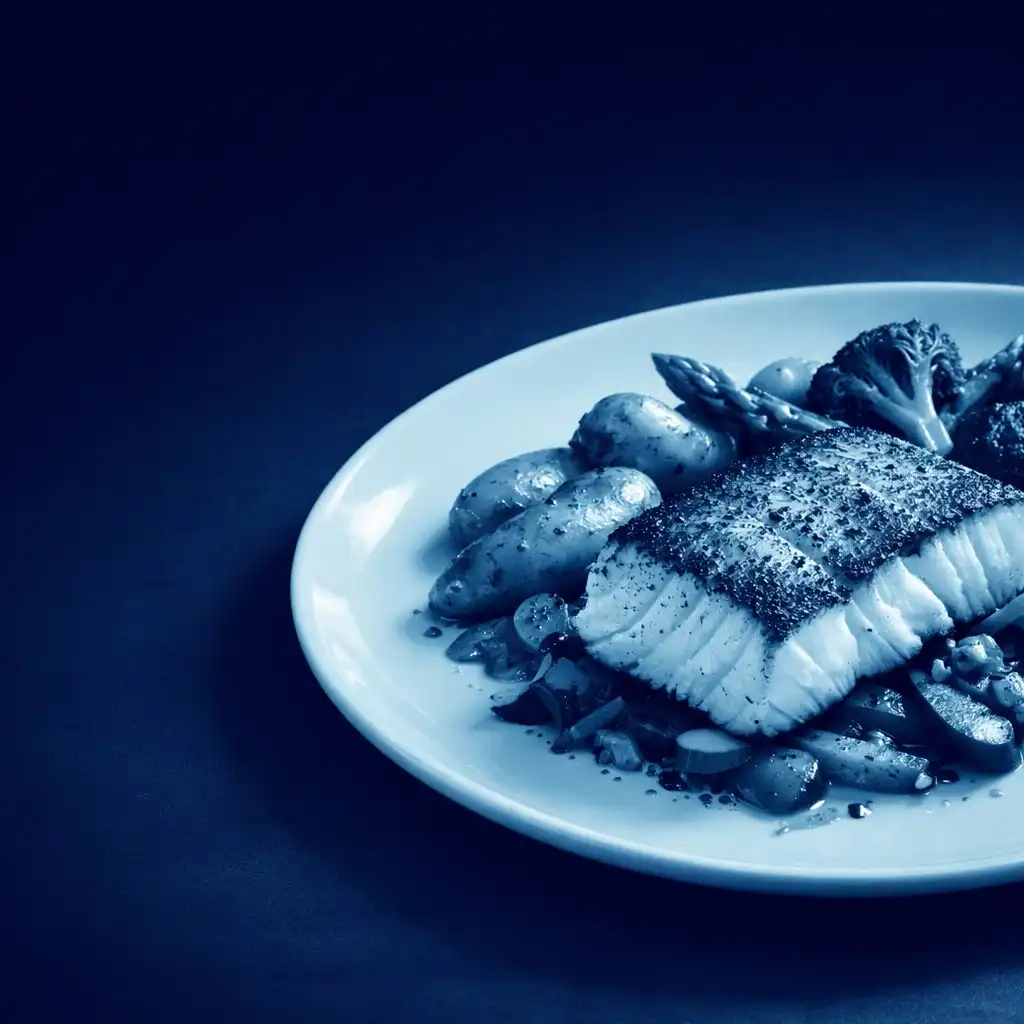 Pan-seared halibut fillet with seasonal vegetables